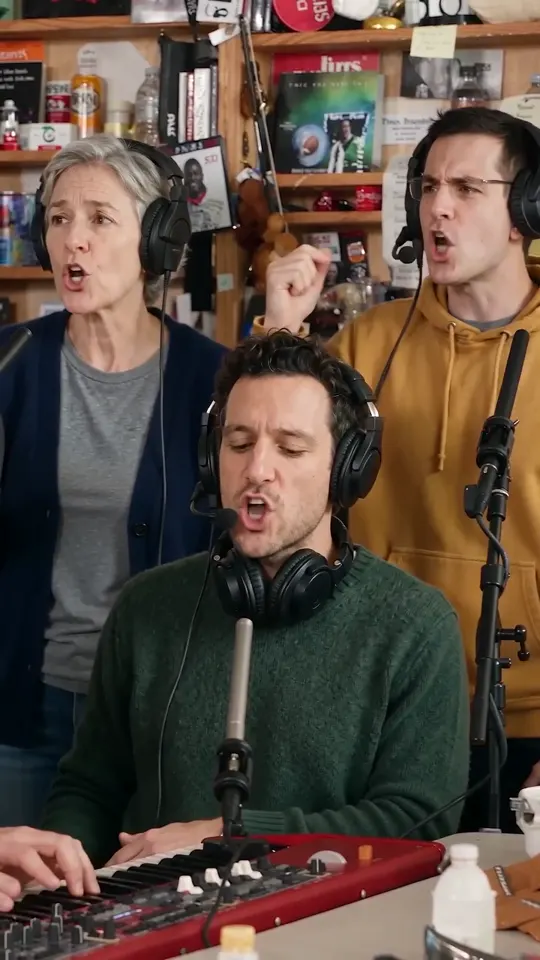Back to the band: the young man in the mustard hoodie raises a fist while the keyboard player sings the last chord